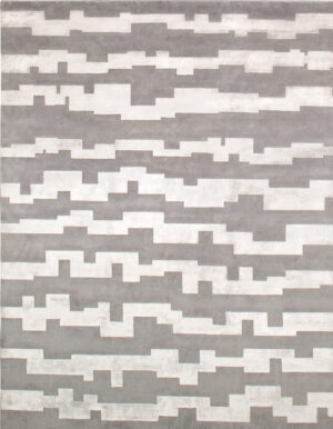 Gray carpet made in wool and silk whose design is made of stripes of irregular shape